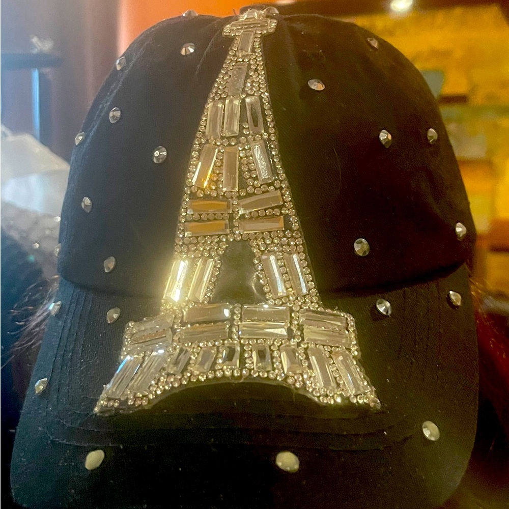 Black cap with rhinestone Eiffel Tower, and rhinestone dots on the front &.sides